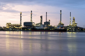 A view of an industrial landscape in the evening light.  
