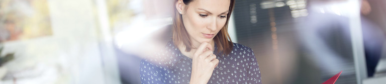 Woman studies text in a folder